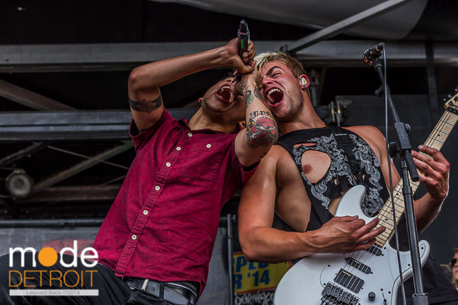 Vocalist ANDY LEO and Lead Guitarist BENN SUEDE of Crown The Empire performing at Vans Warped Tour in Auburn Hills Michigan at The Palace of Auburn Hills on July 18th 2014